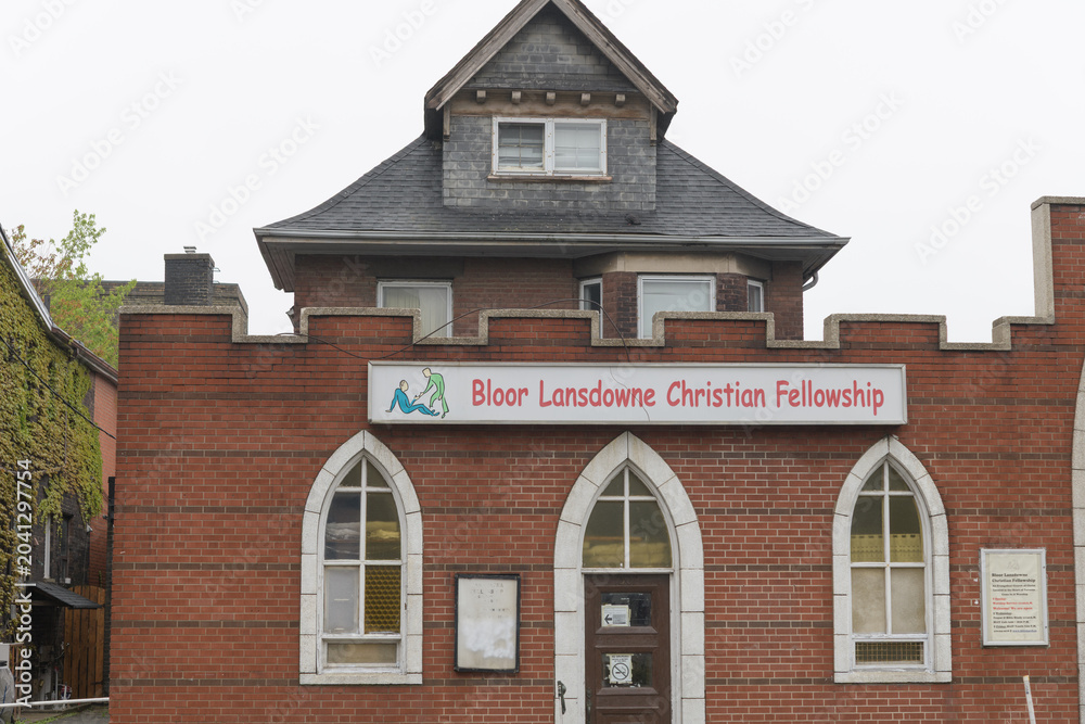 Naklejka premium exterior building facade and sign of Bloor Lansdowne Christian Fellowship located at 1307 Bloor St W, Toronto
