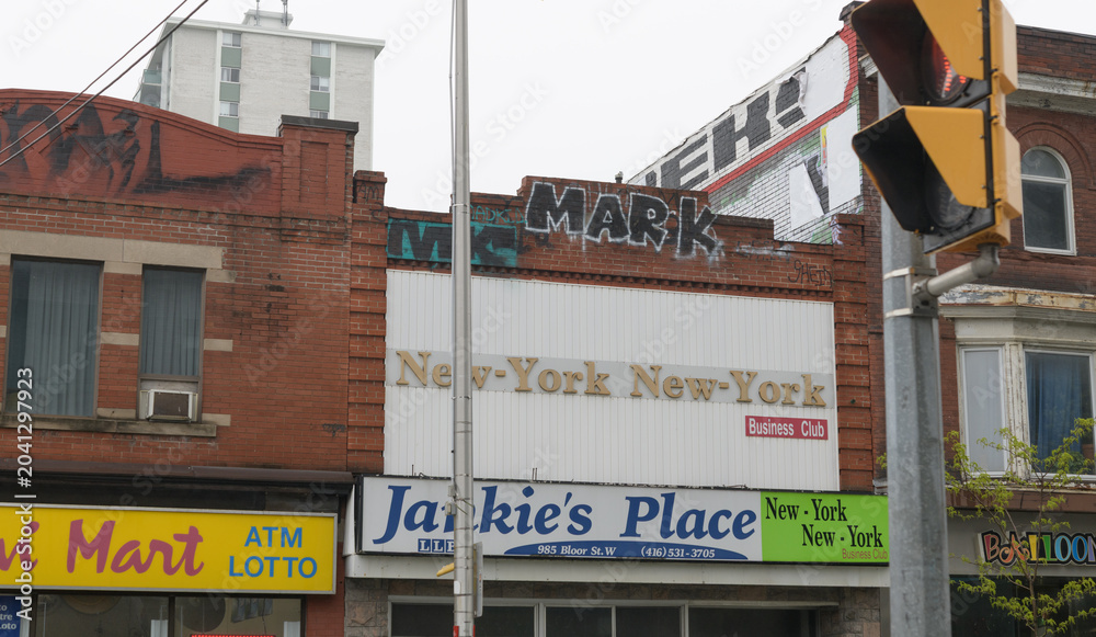 Naklejka premium facade with signs at 985 Bloor St W, location of Jankie's Place / New York New York Business Club, Toronto