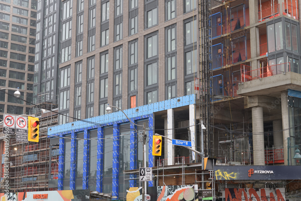 Naklejka premium construction of Fitzrovia's Marlow, a 33 storey tower integrating the 1907 Beaux-Arts Kent School, on Dufferin St south of Bloor St W, Toronto