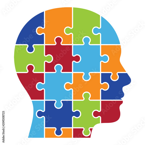 Colorful puzzle pieces forming a human head shape profile side view icon