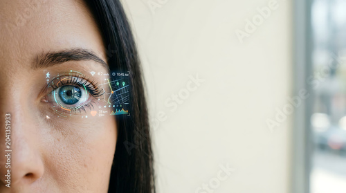 Woman eye with futuristic augmented reality digital interface
