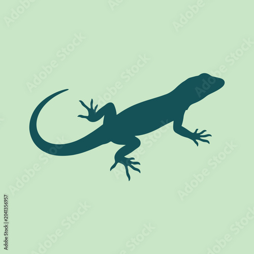 Tableau sur toile A dark green silhouette of a small lizard on light background