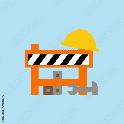 A yellow hard hat sits on an orange construction barrier icon