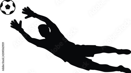 Soccer goalkeeper silhouette diving to save a goal