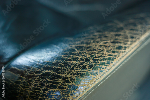 Принти на полотні Close up macro view revealing cracked leather worn texture of an old seat surfac