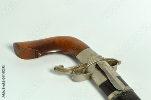 Fotografía Traditional Gecong dagger of the Bugis people displayed on a white background, highlighting Indonesian craftsmanship and cultural heritage