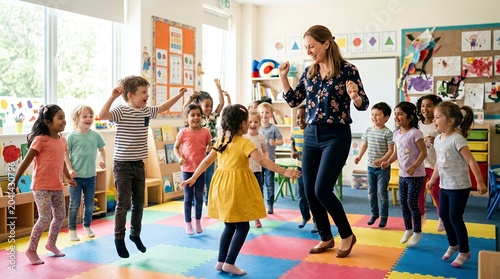 Energetic group of diverse young children and their female teacher dancing and playing in a brightly lit preschool classroom with colorful mats.