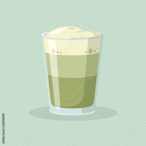 A refreshing beverage with a foamy top in a clear glass on a light background