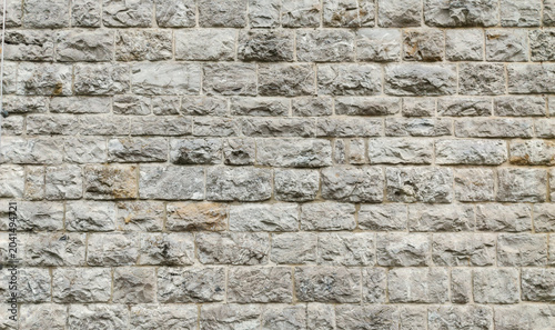 Fényképezés Ancient stone wall texture background with grey stones for medieval architectura