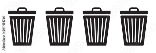 Tableau sur toile Set of four simple black trash can icons with lids on transparent background