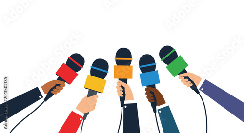 Multiple hands holding up professional microphones with colorful cubes during a busy media press conference event.