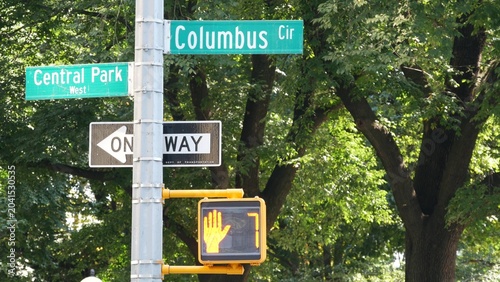 New York City Broadway street sign on Manhattan, United States. Urban road sign in american city. Traffic sign in Midtown of NYC USA. Traffic light near Columbus circle and Central Park. One way arrow