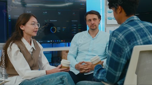 Diverse creative team use Ai Assistant (artificial intelligence assistant) on AI-assisted display for Marketing Data Analyst meeting at office.Coding team,develop Ai Assistant,business brainstorming