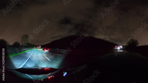 Night Drive on Highways. Car Mounted Camera Footage of Illuminated British Road Travel and Traffic During Night Drive on Motorways and Highways of England United Kingdom