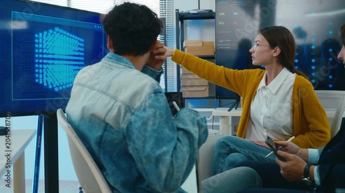 Diverse creative team use Ai Assistant (artificial intelligence assistant) on AI-assisted display for Marketing Data Analyst meeting at office.Coding team,develop Ai Assistant,business brainstorming