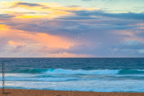Seaside Sunrise with a hint of rain in the clouds