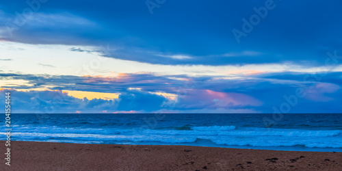 Seaside Sunrise with a hint of rain in the clouds