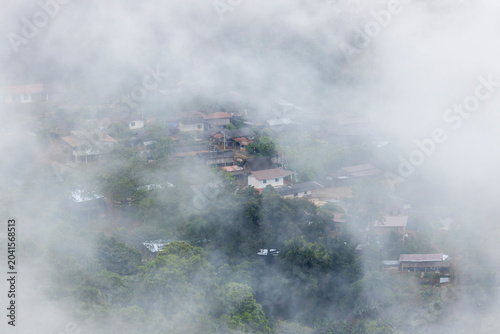 Landscape of Morning Mist with Mountain Layer. mountain ridge and clouds in rural jungle bush forest