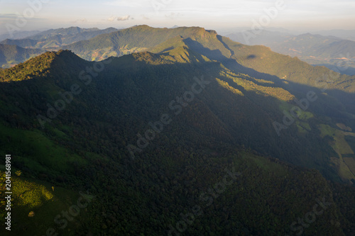 Landscape of Morning Mist with Mountain Layer. mountain ridge and clouds in rural jungle bush forest
