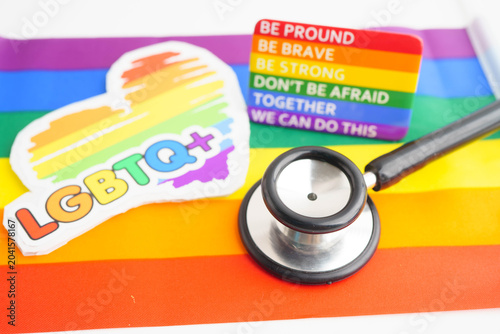 Bild auf Leinwand Stethoscope on LGBT rainbow flag, rights and gender equality.