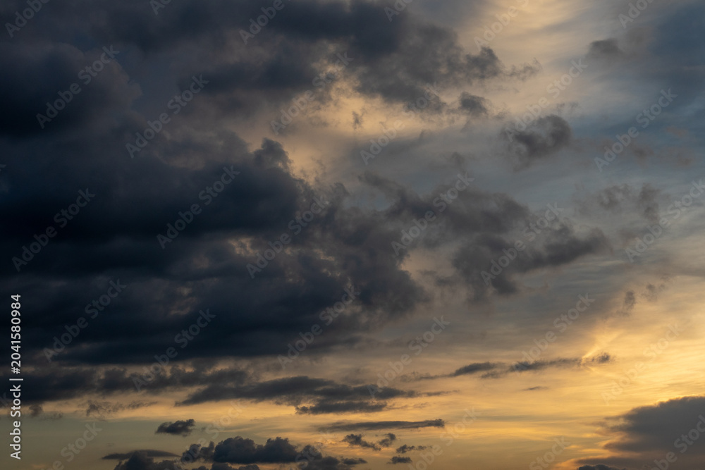 Obraz premium Dramatic Storm Clouds at Sunset