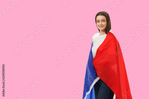Fényképezés Woman proudly displays flag in vibrant space