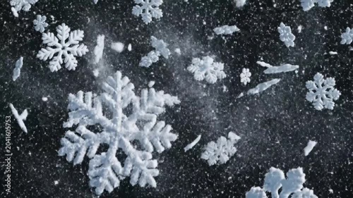 Snowflakes fall gently in the night sky with large delicate crystal