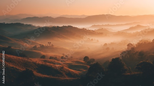 Aerial View of Rolling Hills and Mist at Golden Sunrise