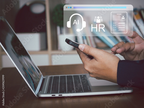 AI headset icon human resources interface over professional using smartphone and laptop in office, focused and productive