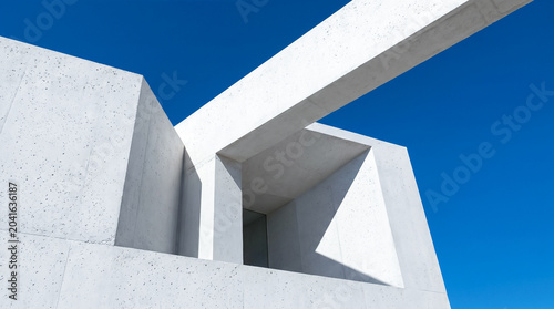 Abstract modern geometric white concrete architectural building structure standing strongly against solid clear blue sky creating perfect minimal simple construction background