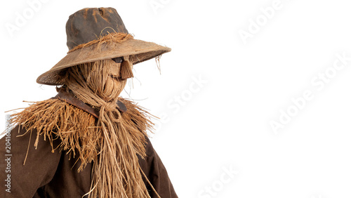Tableau sur toile Scary Halloween scarecrow character wearing a vintage brown straw hat isolated o