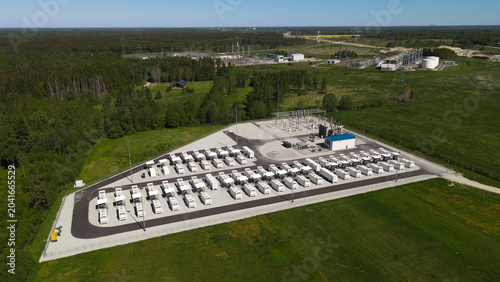 Schilderij op canvas Large grid scale battery storage system featuring numerous containerized units a