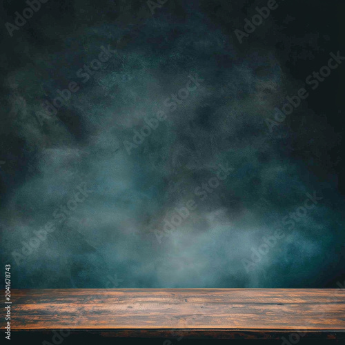 Rustic brown wooden tabletop with prominent grain in front of a dark, moody teal textured background, creating an atmospheric setting