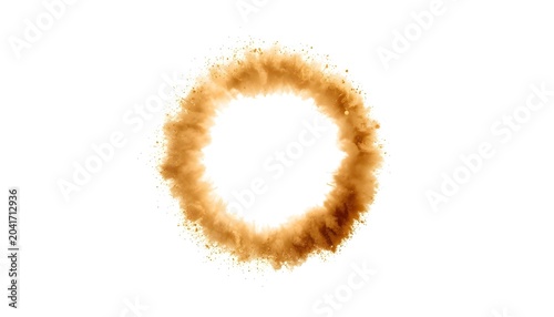 A brown powder explosion forming a circular shape on a white background