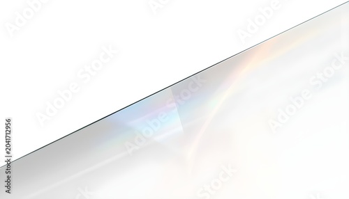 A sleek, modern glass surface reflecting light and colors in a minimalist setting