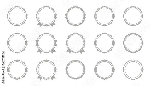 A collection of blank award badges and ribbons on a white background