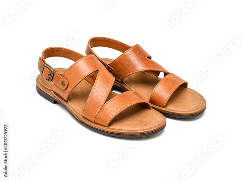 Brown leather sandals isolated on white background.