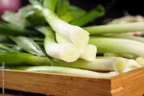 Fresh Green Onions Scallions on Wooden Cutting Board Kitchen Vegetables Cooking Ingredients