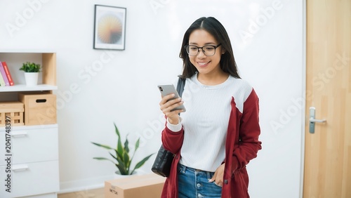 Happy Asian Woman Cell Phone New Apartment