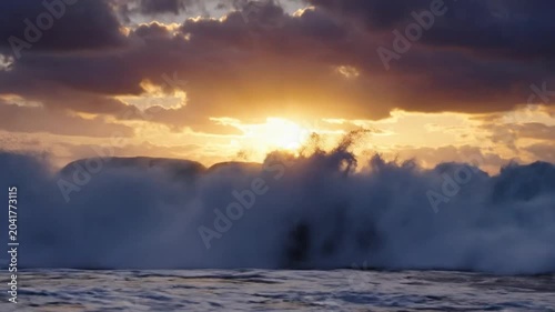 Epic ocean wave crashing under a golden sunset with dark clouds and dramatic atmosphere