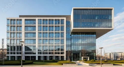 Obraz Modern architectural office building with glass facade and unique design.