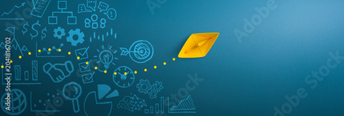 Yellow paper ship and business strategy on blue background, Business success, innovation and solution concept, copy space