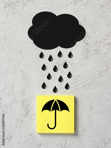 Insurance, protection and risk management concepts with umbrella icon on sticky note under raining cloud