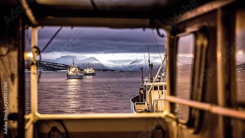 Trawlers ship at night in the Norwegian sea, the fjords of Norway.
