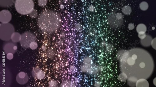 Multicolor glitter particles falling downward with soft bokeh light effects for festive backgrounds