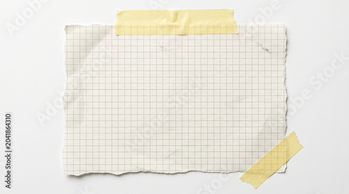 Schilderij op canvas Realistic torn graph paper with yellow adhesive masking tape on white background