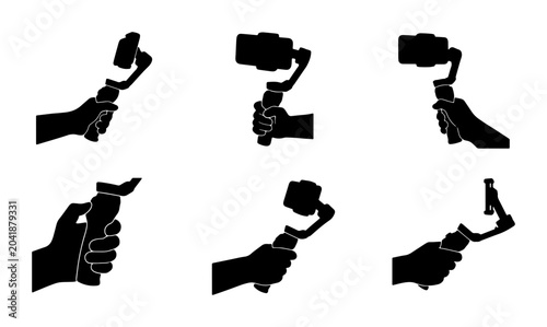 Tableau sur toile Hand holding smartphone gimbal stabilizer for smooth video recording, silhouette