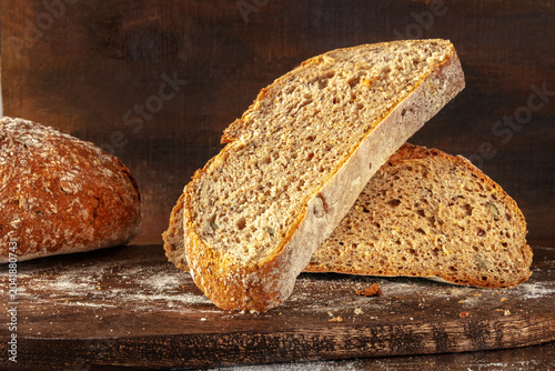 Homemade artisan sourdough bread loaf on a rustic wooden cutting board