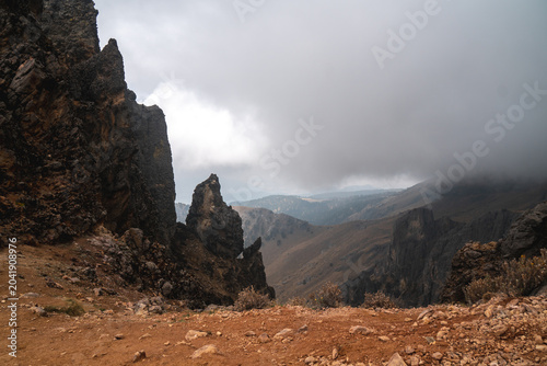Dramatic rocky landscape at Popocatépetl Mexico with cloudy sky ideal for hiking and adventure travel during a misty day