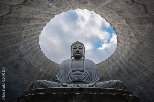 Konstfotografi Epic low angle view of the giant Atama Daibutsu (Hill of the Buddha) statue fram